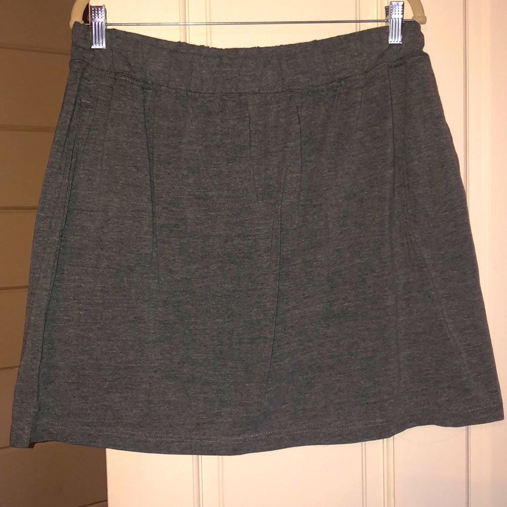 Woman Within Gray Skort